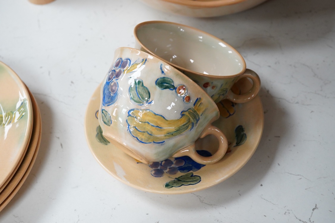 A collection of Doulton Brangwynware to include a bowl, two teacups and seven side plates, largest 34cm in diameter